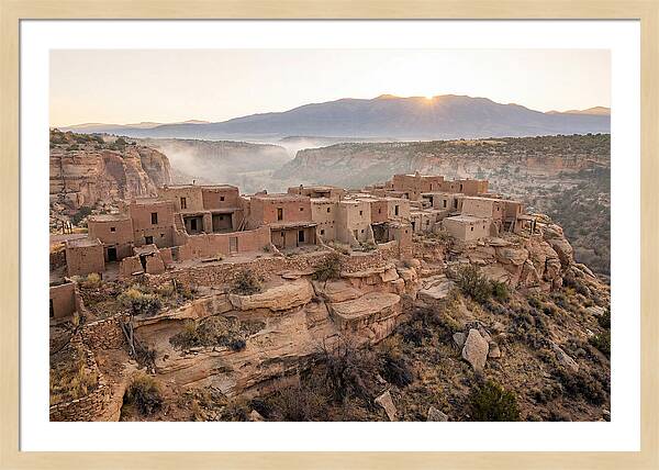 Adobe Pueblo Buildings At Sunset
