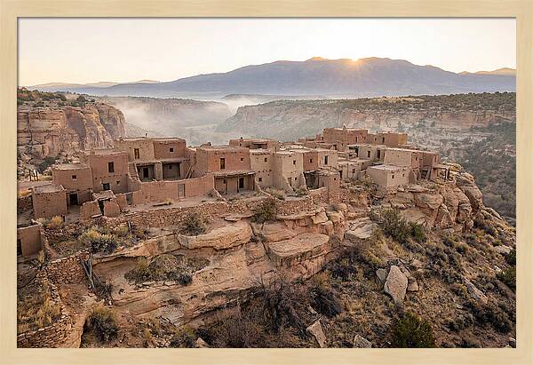 Adobe Pueblo Buildings At Sunset