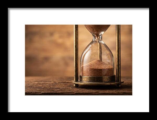 Antique Hourglass On Wood Surface