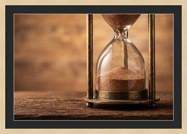 Antique Hourglass On Wood Surface