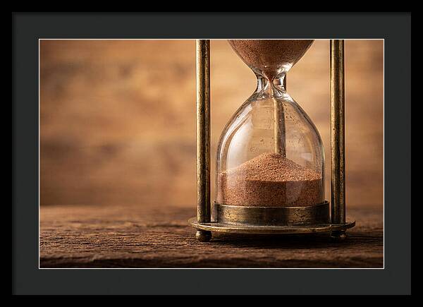 Antique Hourglass On Wood Surface