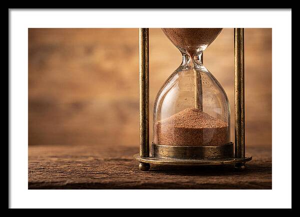 Antique Hourglass On Wood Surface
