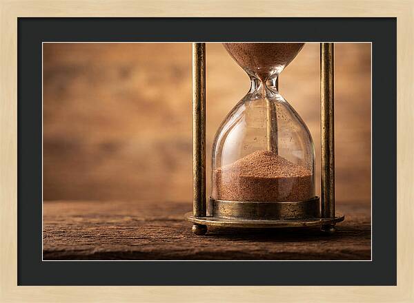 Antique Hourglass On Wood Surface