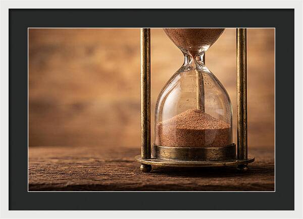 Antique Hourglass On Wood Surface