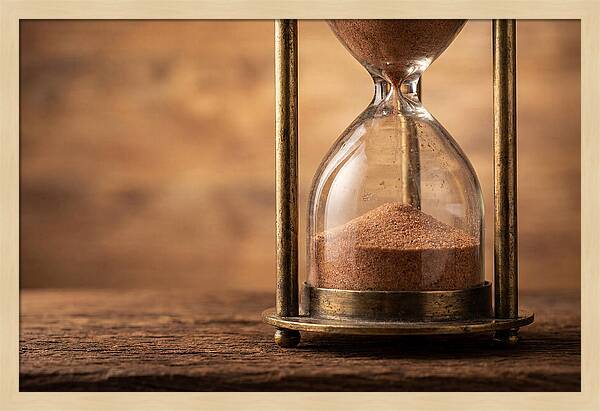 Antique Hourglass On Wood Surface