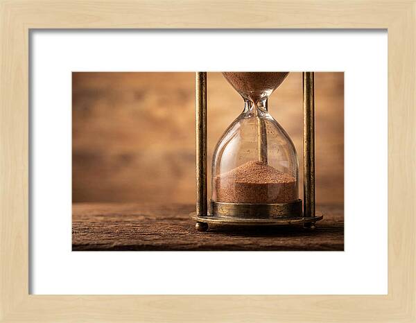 Antique Hourglass On Wood Surface