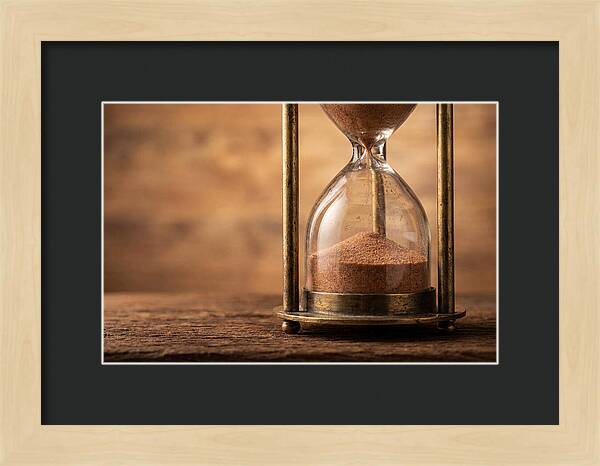 Antique Hourglass On Wood Surface