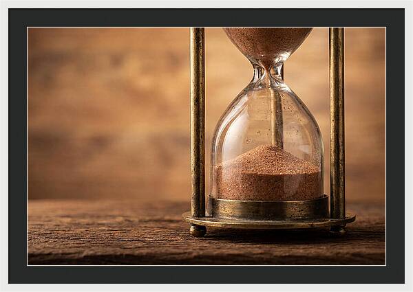 Antique Hourglass On Wood Surface