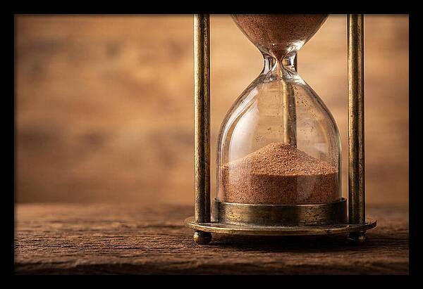 Antique Hourglass On Wood Surface