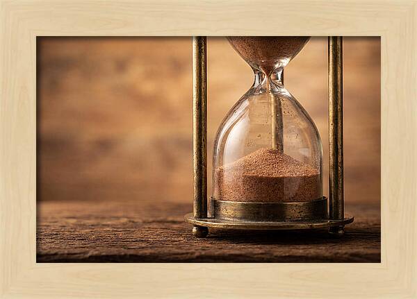 Antique Hourglass On Wood Surface