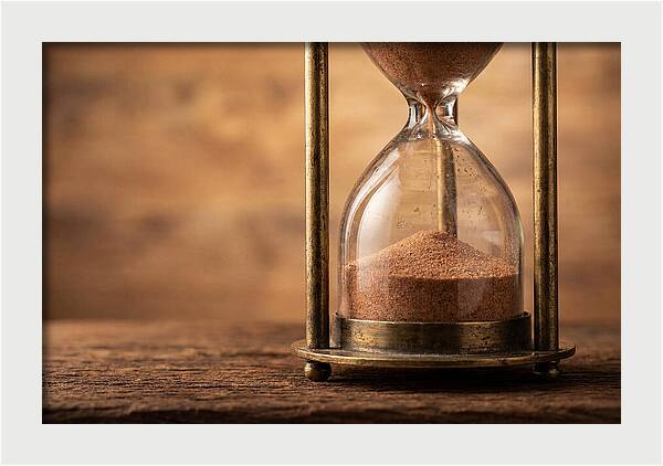 Antique Hourglass On Wood Surface