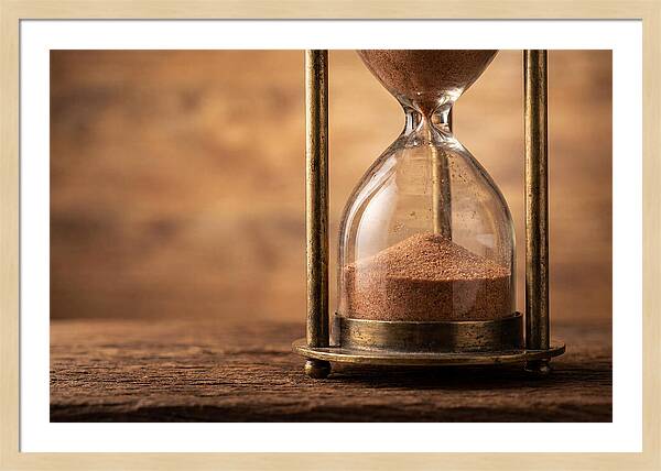 Antique Hourglass On Wood Surface
