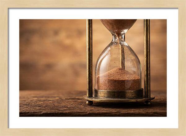 Antique Hourglass On Wood Surface