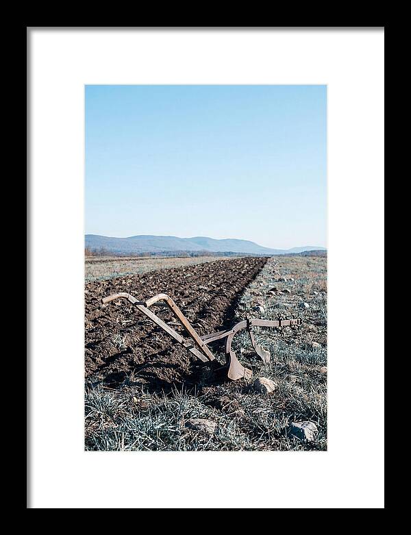 Antique Plow In Freshly Turned Earth