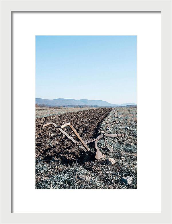 Antique Plow In Freshly Turned Earth