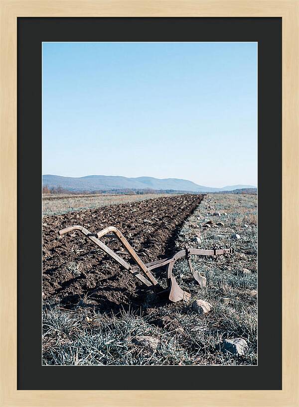 Antique Plow In Freshly Turned Earth