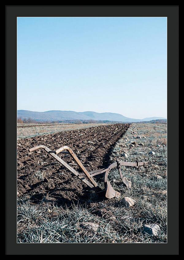 Antique Plow In Freshly Turned Earth