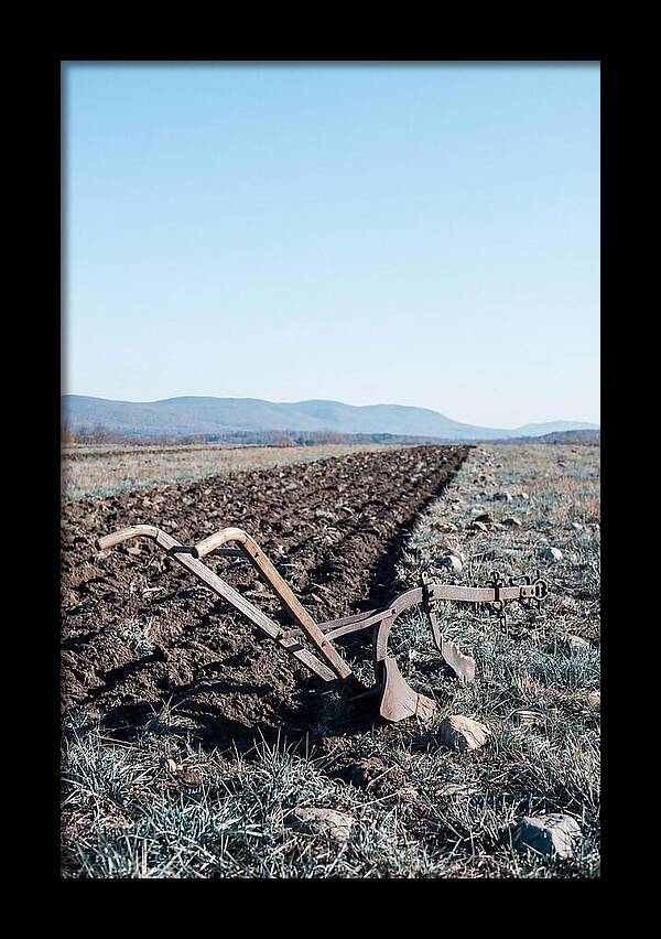 Antique Plow In Freshly Turned Earth