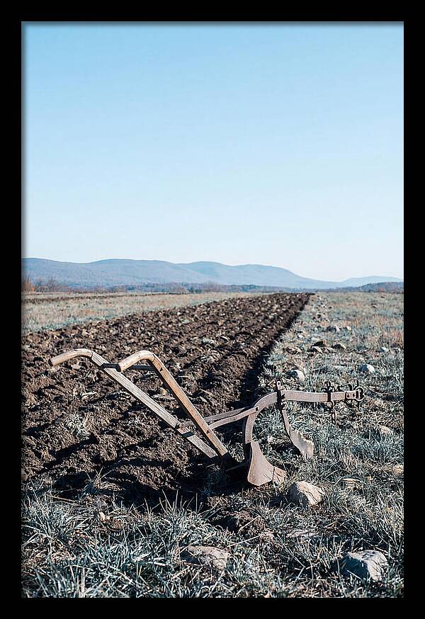 Antique Plow In Freshly Turned Earth