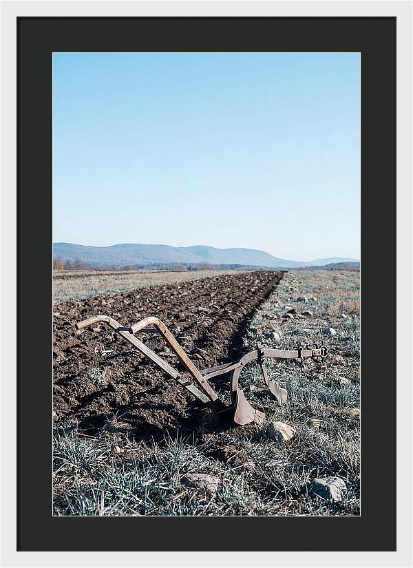Antique Plow In Freshly Turned Earth
