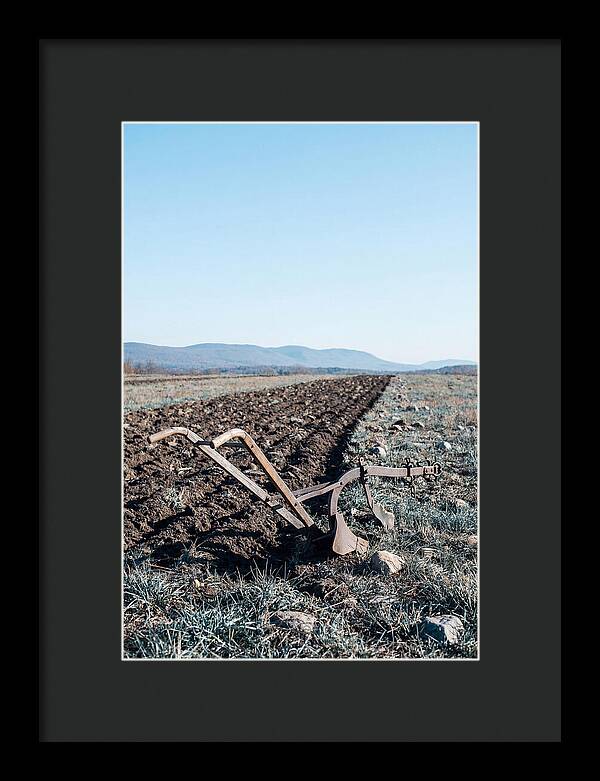 Antique Plow In Freshly Turned Earth