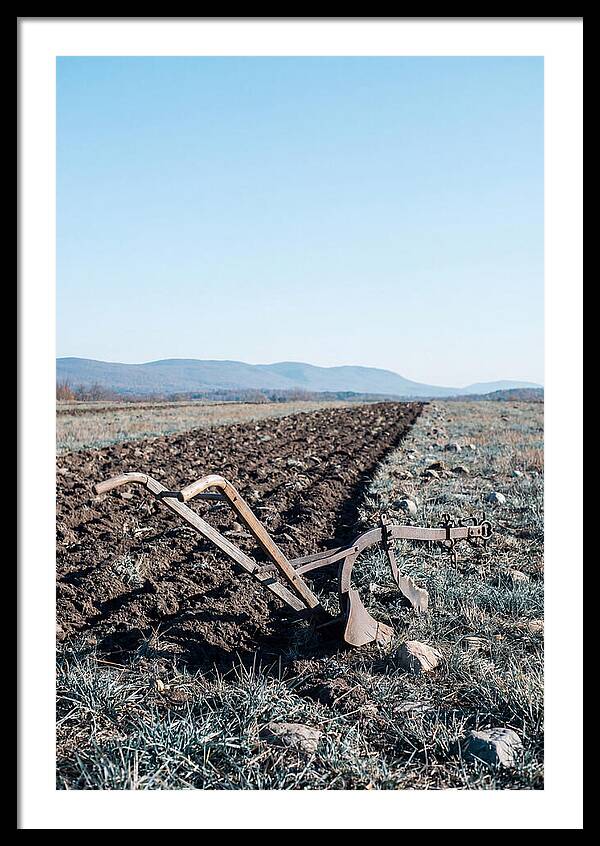 Antique Plow In Freshly Turned Earth