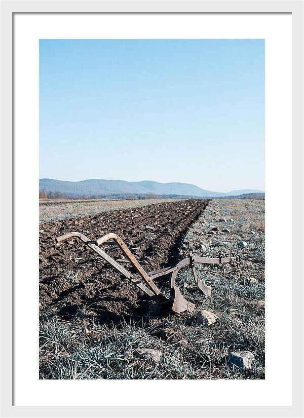 Antique Plow In Freshly Turned Earth