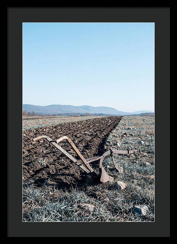 Antique Plow In Freshly Turned Earth