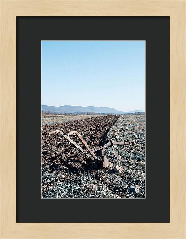 Antique Plow In Freshly Turned Earth