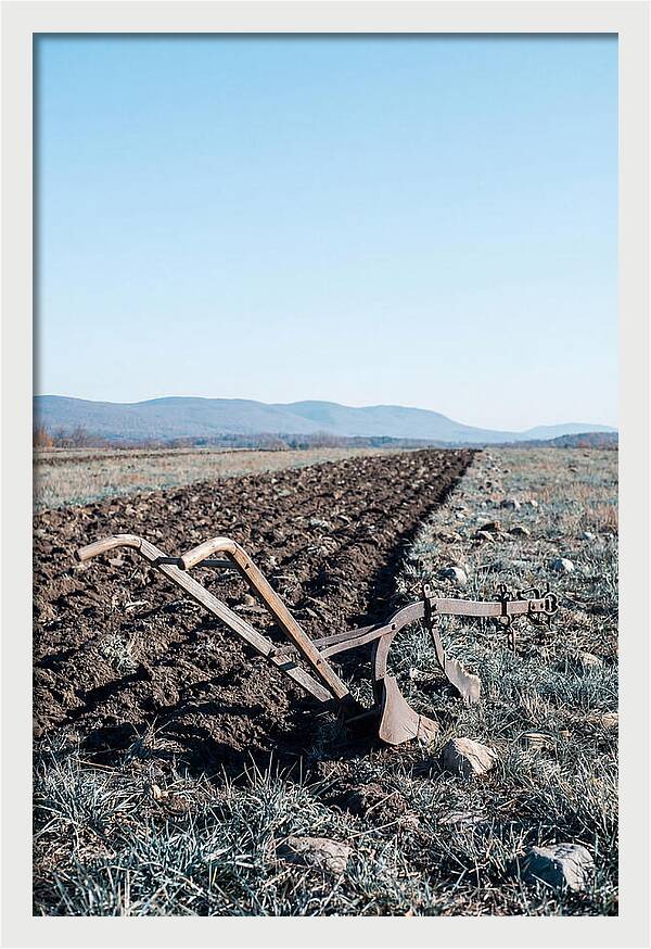 Antique Plow In Freshly Turned Earth