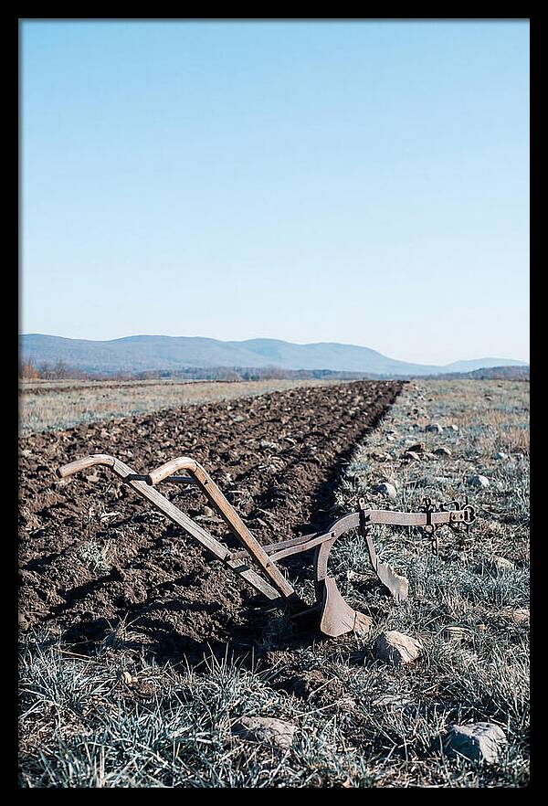 Antique Plow In Freshly Turned Earth