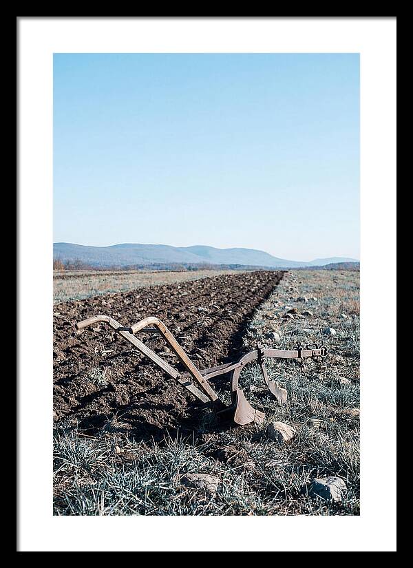 Antique Plow In Freshly Turned Earth