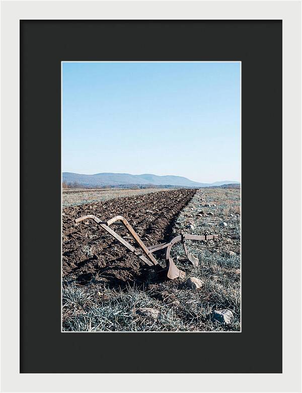 Antique Plow In Freshly Turned Earth