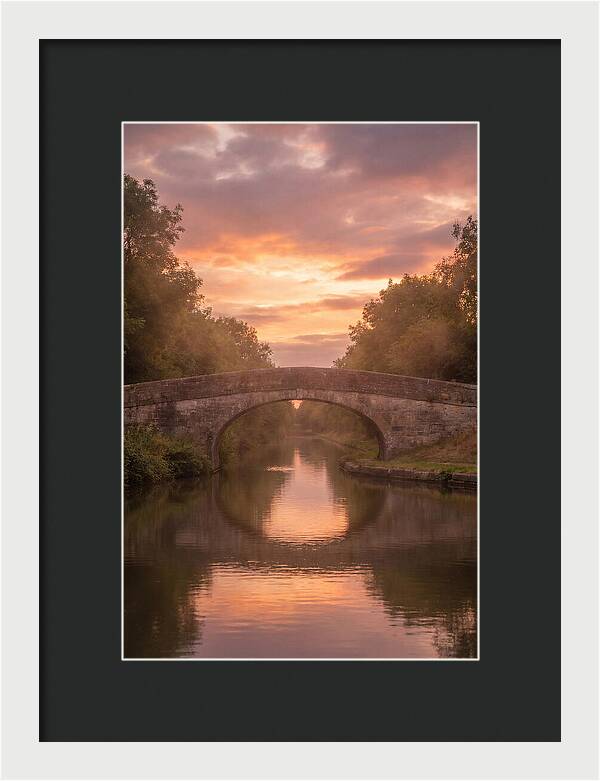 Arched Bridge Over Tranquil Canal
