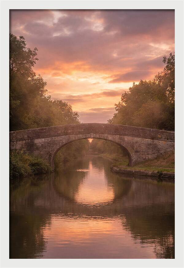Arched Bridge Over Tranquil Canal