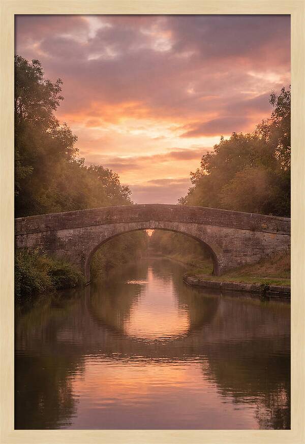Arched Bridge Over Tranquil Canal