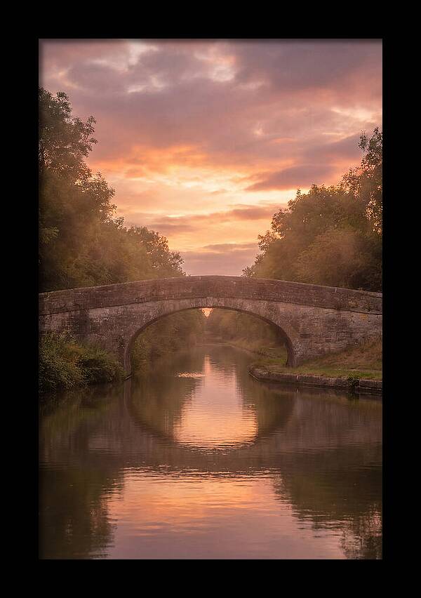 Arched Bridge Over Tranquil Canal