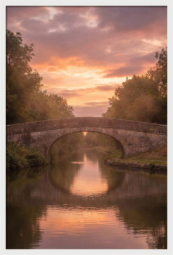 Arched Bridge Over Tranquil Canal