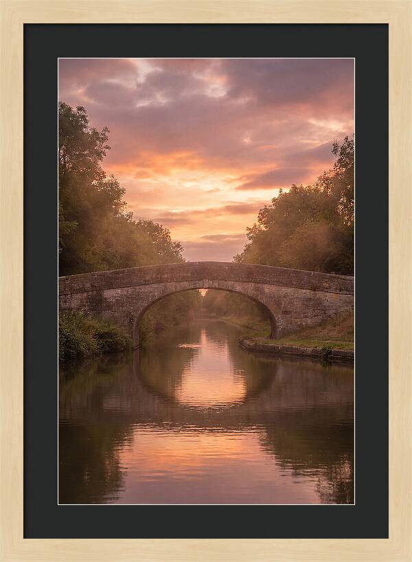 Arched Bridge Over Tranquil Canal