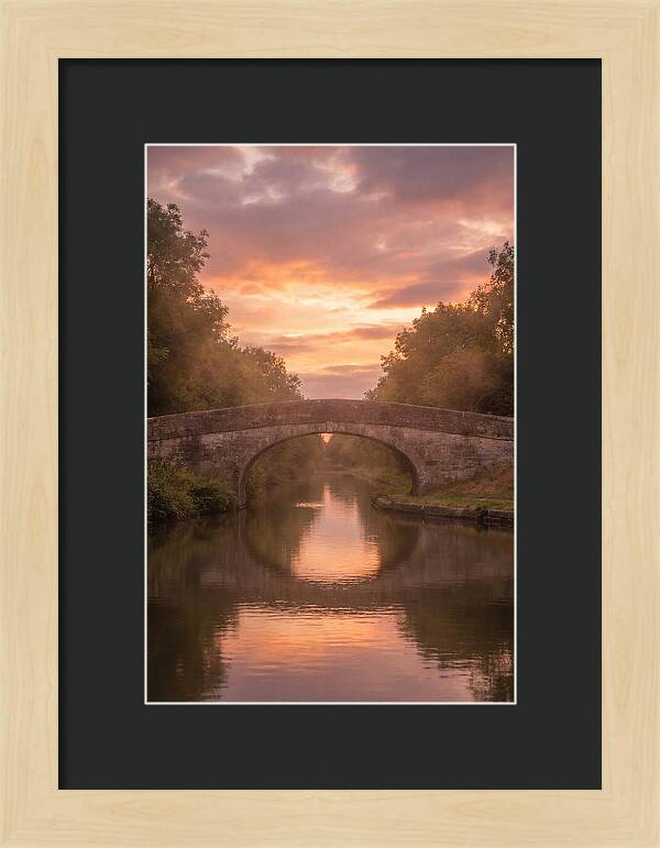 Arched Bridge Over Tranquil Canal