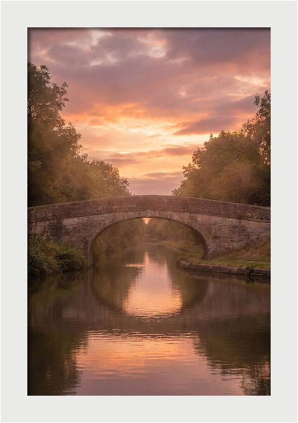 Arched Bridge Over Tranquil Canal