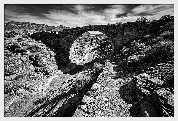 Arching Stone Bridge Over Canyon