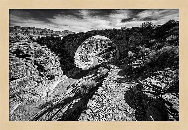 Arching Stone Bridge Over Canyon