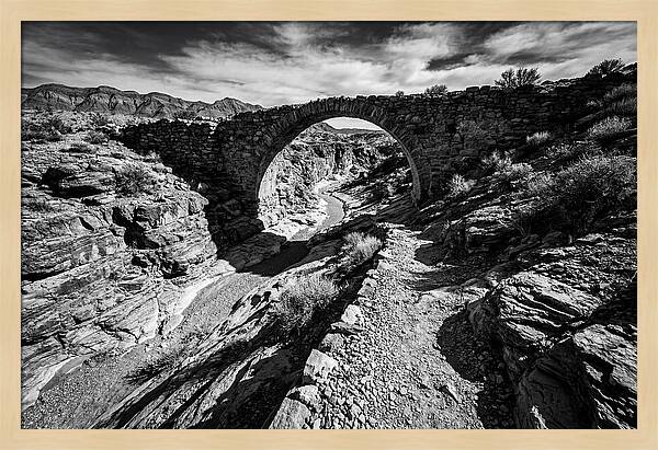 Arching Stone Bridge Over Canyon