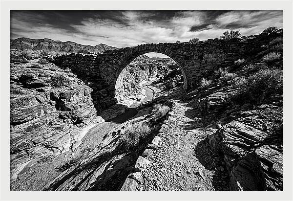 Arching Stone Bridge Over Canyon