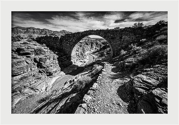 Arching Stone Bridge Over Canyon