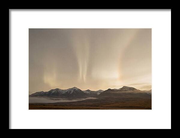 Aurora Pillars Rising Above Mountains