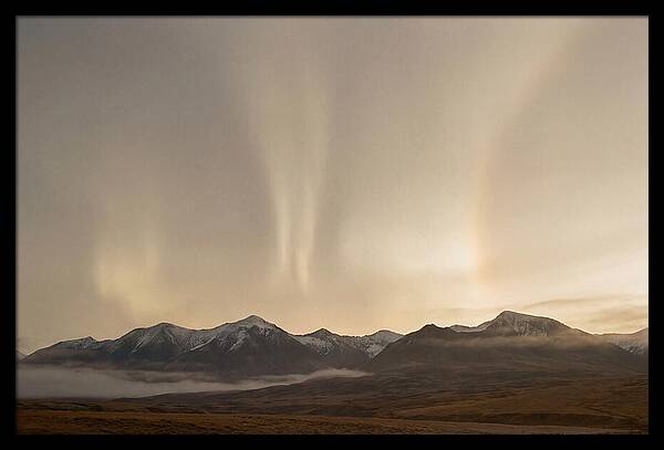 Aurora Pillars Rising Above Mountains