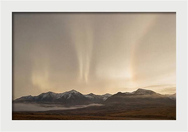 Aurora Pillars Rising Above Mountains