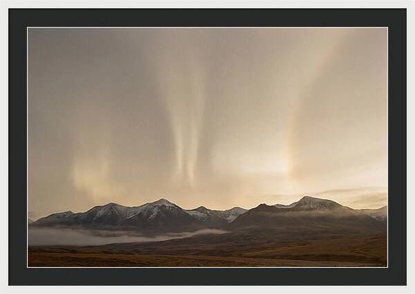 Aurora Pillars Rising Above Mountains